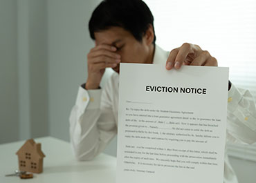  Man holding an eviction notice from landlord