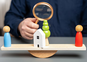 A person with a magnifying glass, symbolizing scrutiny in Travis County eviction issues